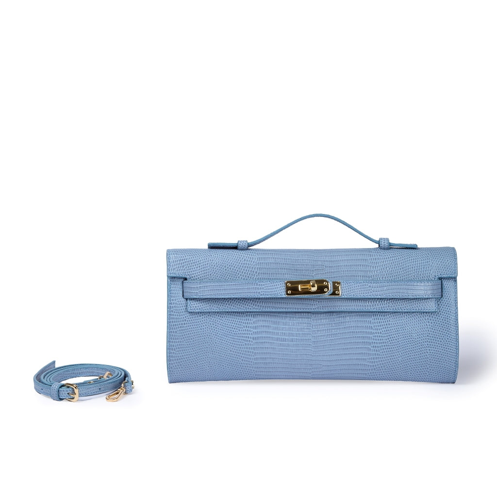 Jade Tejus clutch in leather featuring a secure closure, a retractable handle, and a detachable, adjustable shoulder strap.