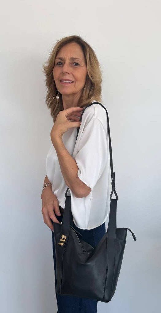 Amina small leather handbag with wrapped tubular handle and detachable shoulder strap