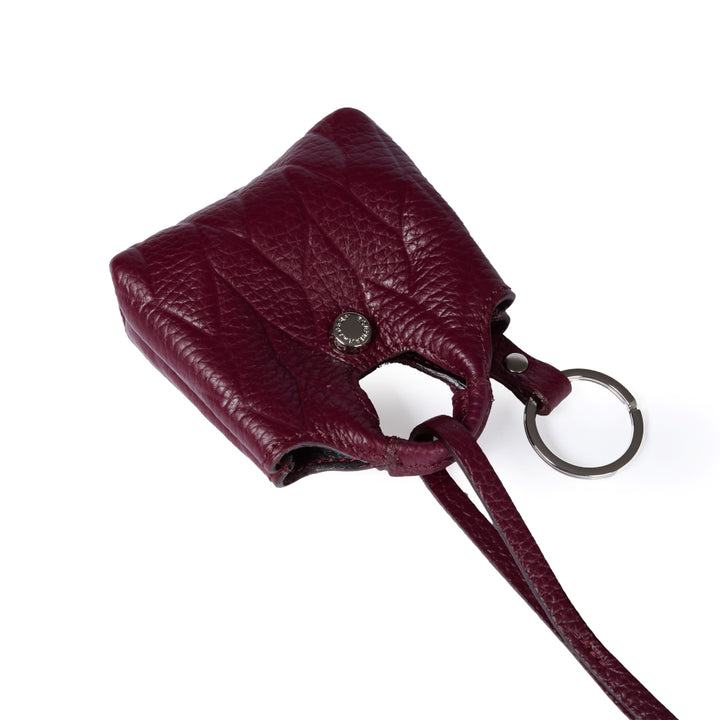 Woven charms air pods holder in braided printed leather