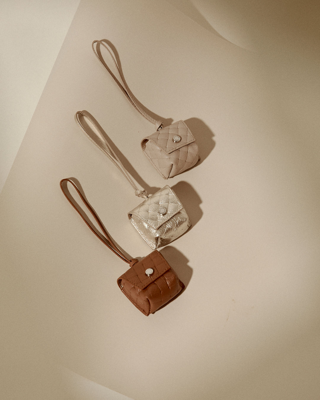 Woven charms air pods holder in braided printed leather