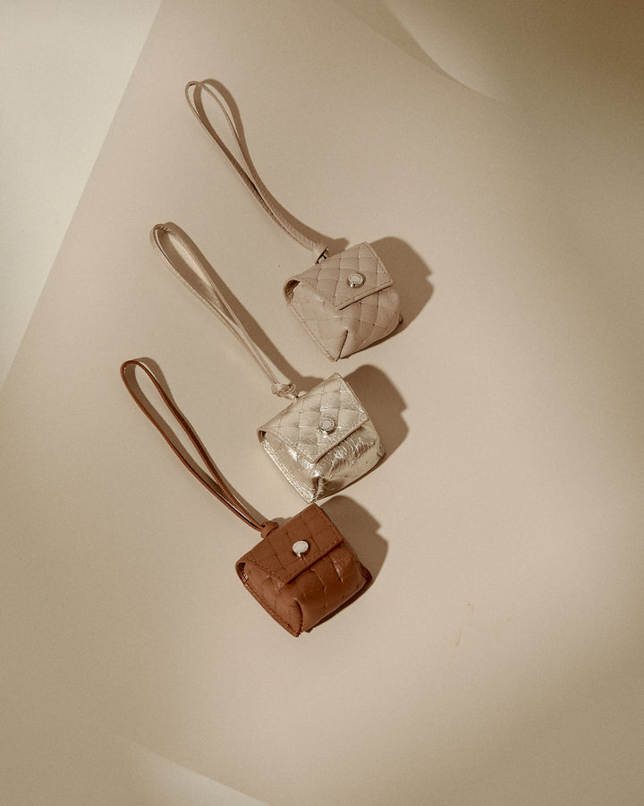 Woven charms air pods holder in braided printed leather